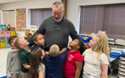 Teacher with elementary students at Redeemer Lutheran School in Kokomo, IN