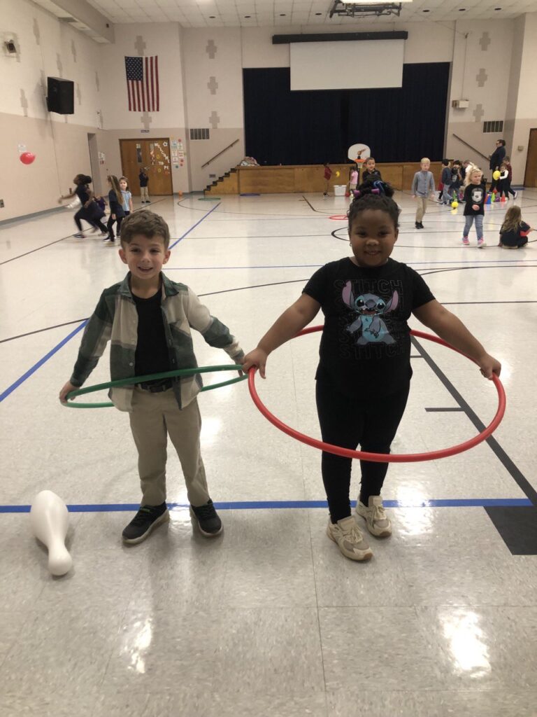 Two children with hula hoops at Redeemer Lutheran School event